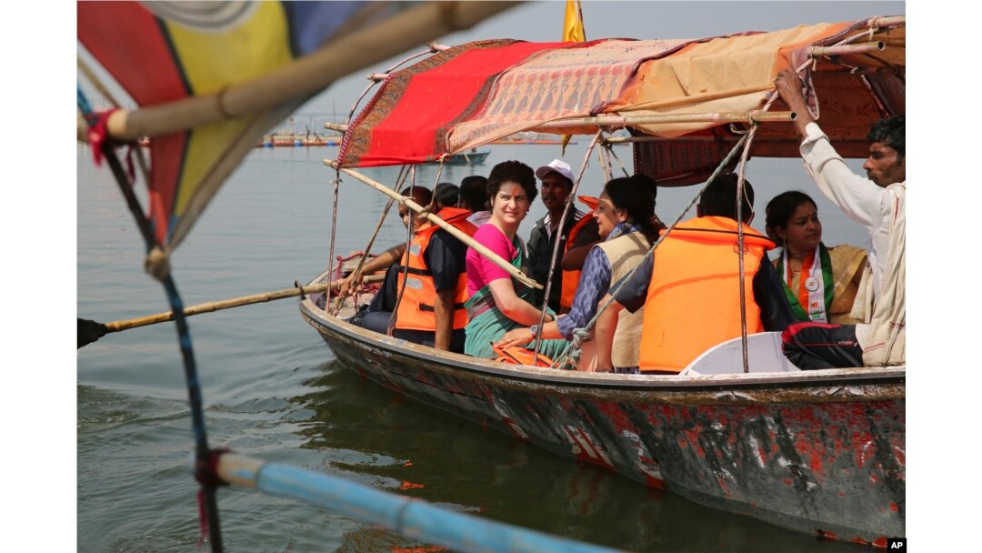 Congress party General Secretary and eastern Uttar Pradesh state in-charge Priyanka Gandhi Vadra, center, takes a boat ride to the Sangam, the confluence of sacred rivers the Yamuna, the Ganges and the mythical Saraswati, in Prayagraj, India, March 18, 2019.
