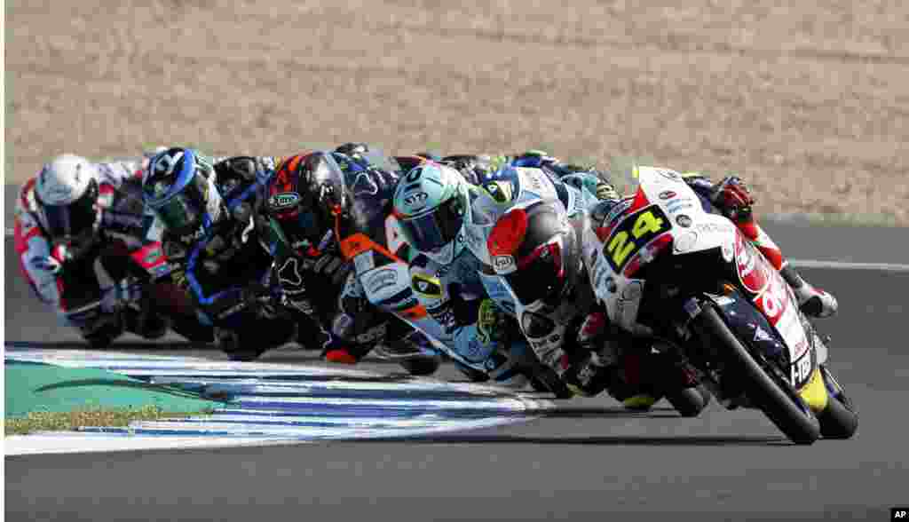 Moto3 rider Tatsuki Suzuki of Japan, right, takes a curve during the Spanish Motorcycle Grand Prix at the Angel Nieto racetrack in Jerez de la Frontera, Spain.