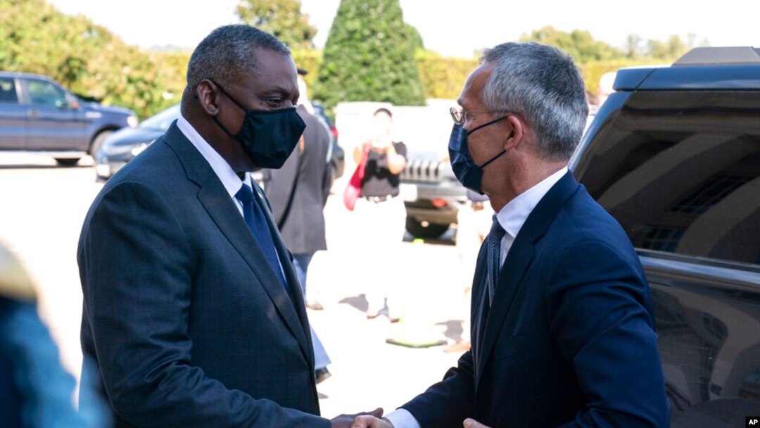 Secretary of Defense Lloyd Austin, left, greets NATO Secretary General Jens Stoltenberg upon his arrival at the Pentagon, Oct. 4, 2021.