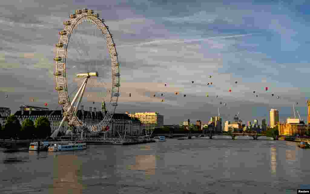 Hot air balloons fly over London as a part of the Lord Mayor's Hot Air Balloon Regatta, London, in this image obtained from social media.
