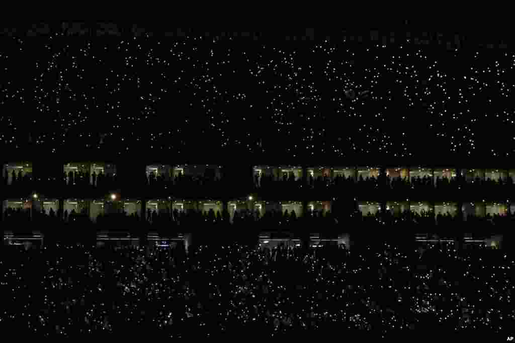 Fans light up their mobile phones in the stands prior to the CONCACAF Champions League soccer match final between Monterrey and Tigres, in Monterrey, Mexico, May 1, 2019.