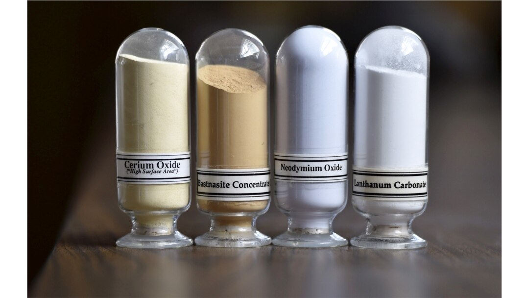 FILE - Samples of rare earth minerals from left, Cerium oxide, Bastnasite, Neodymium oxide and Lanthanum carbonate are on display during a tour of Molycorp's Mountain Pass Rare Earth facility in Mountain Pass, California, June 29, 2015.