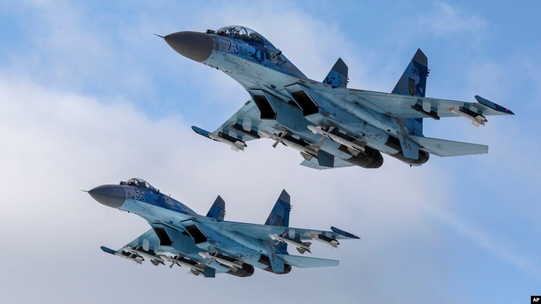 Su-27 fighter jets fly above a military base in the Zhytomyr region, Ukraine, Thursday, Dec. 6, 2018. 