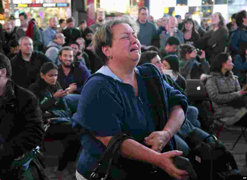 Hany Alexander cries while watching election results in Times Square, New York, Nov. 8, 2016.