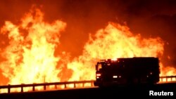 A fire truck is pictured, as a wind-driven wildfire burns in Canyon Country, north of Los Angeles, California, Oct. 25, 2019.