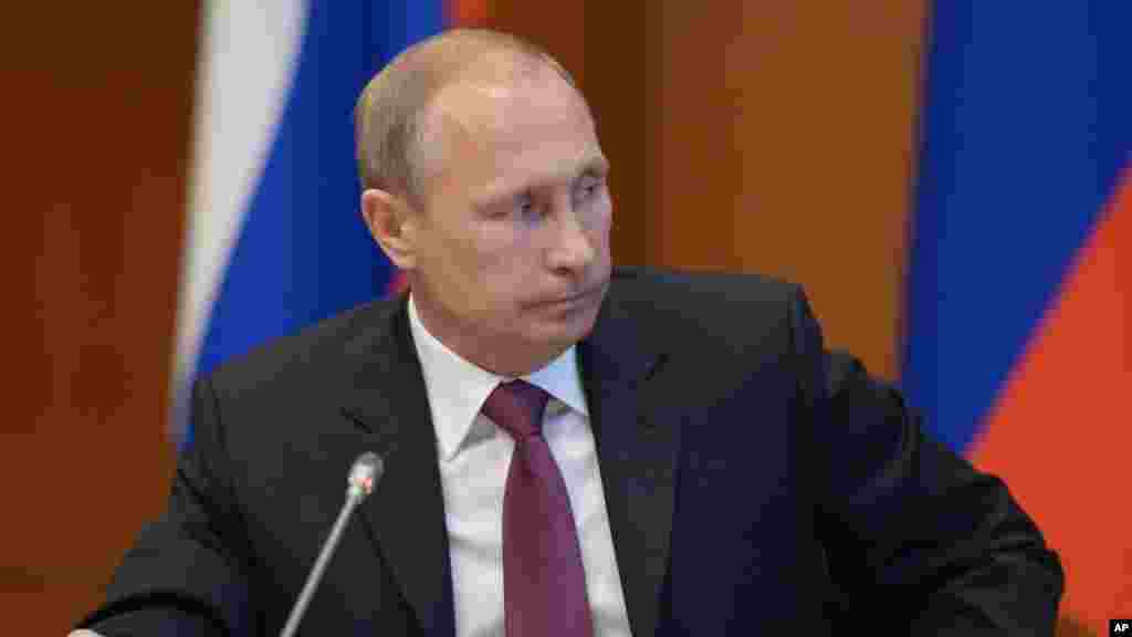Russian President Vladimir Putin listens during a meeting on development of the Russian Far East issues in Yakutsk, Russia, Sept. 1, 2014.