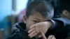 FILE - An autistic child attends a therapy session in Beijing, China, March 23, 2009. 