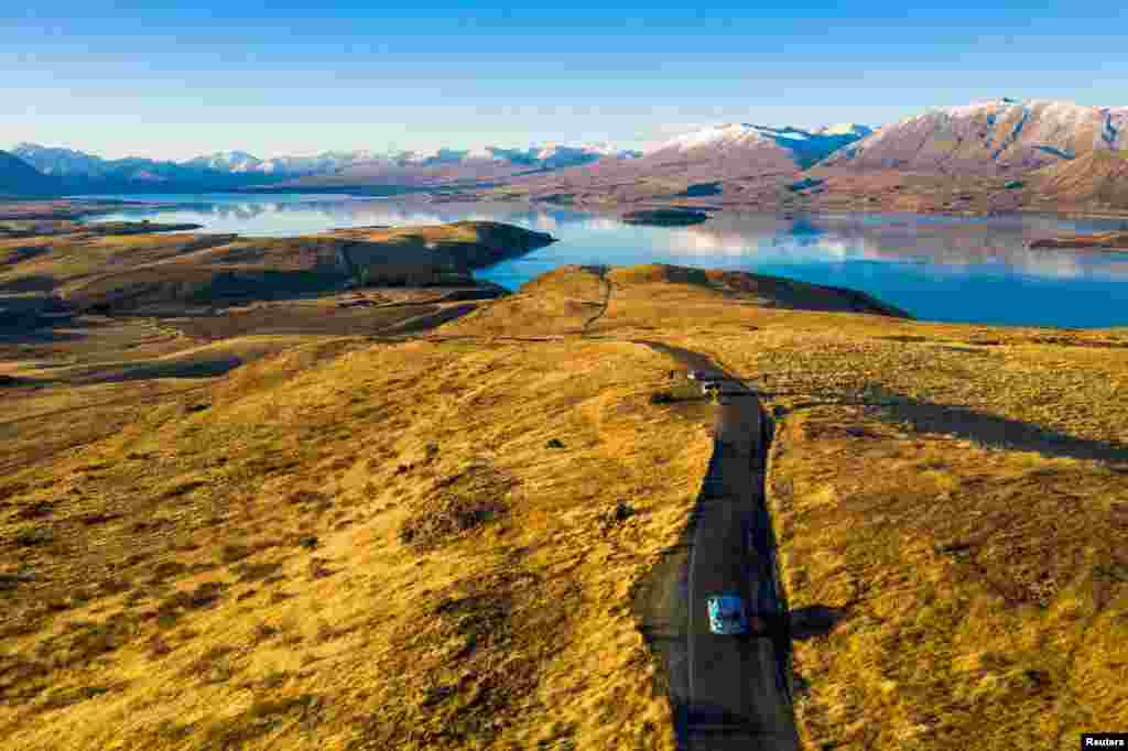 Dutchman Wiebe Wakker drives his electric vehicle, the Blue Bandit, along Lake Tekapo, New Zealand. (Wiebe Wakker handout)