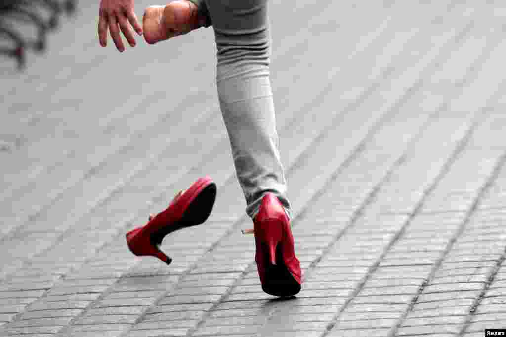 A participant takes part in a high heel race to protest in favor of gender equality in Monterrey, Mexico, May 12, 2019.