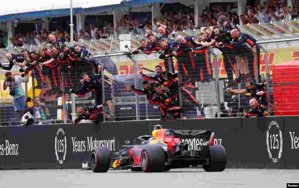 Red Bull's Max Verstappen crosses the line to win the German Formula One Grand Prix at the Hockenheim racing circuit in Hockenheim, southern Germany.