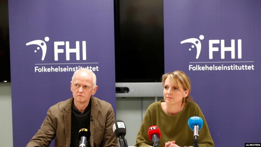 Officials in Norway's Public Health Agency, Geir Bukholm and Line Vold, speak during a news conference about the spread of the coronavirus in their country, at the Institute of Public Health in Oslo, Norway, Feb. 26, 2020. 