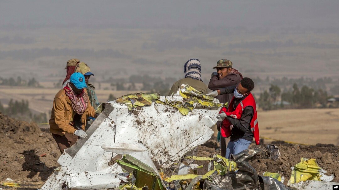 FILE - Rescuers work at the scene of an Ethiopian Airlines flight crash near Bishoftu, or Debre Zeit, south of Addis Ababa, Ethiopia, March 11, 2019.