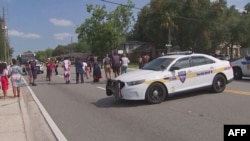 This video grab shows police cars on the site of a shooting in Jacksonville, Florida, August 26, 2023.