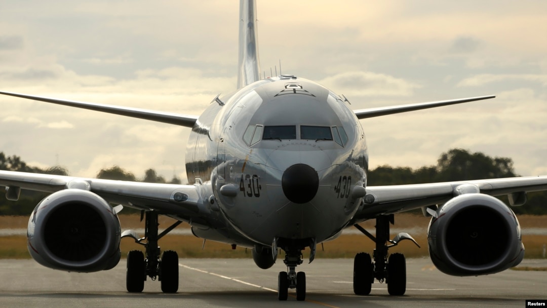 FILE - A U.S. Navy P8 Poseidon aircraft returns from a search flight for Malaysia Airlines flight MH370 over the Indian Ocean, at Perth International Airport. A U.S. defense official said further P8 deployments in Singapore could be expected.