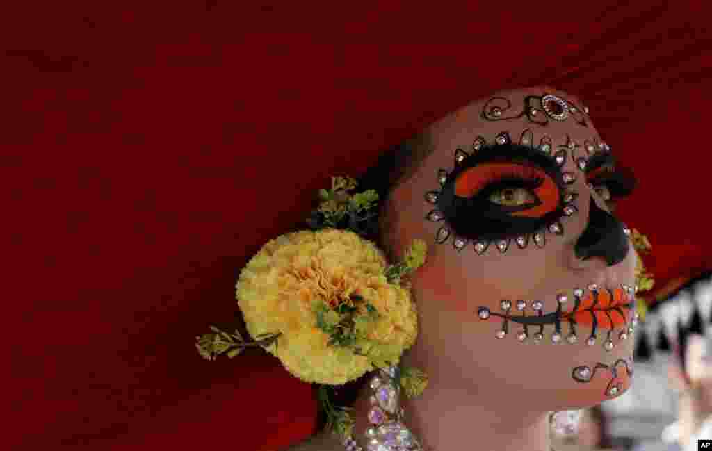 A reveler dressed as a Mexican "catrina" participates in the gay pride parade in Bogota, Colombia, June 30, 2019.