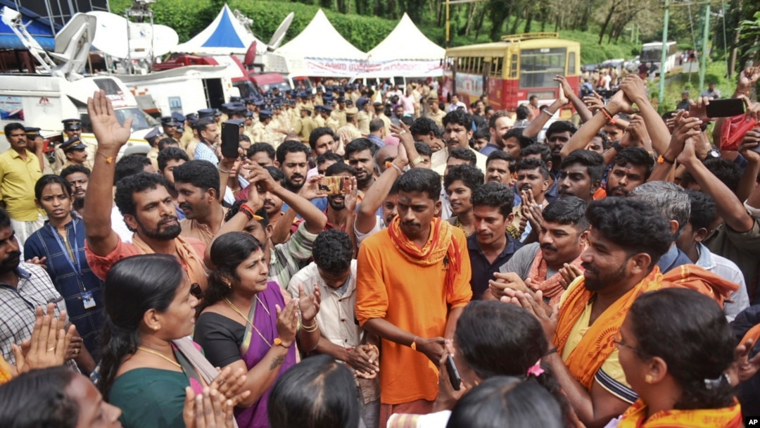 Protesters who are opposed to allowing women of menstruating age to enter the Sabarimala temple chant devotional hymns as they gather at Nilackal, a base camp on way to the mountain shrine in Kerala, India, Oct. 17, 2018. 
