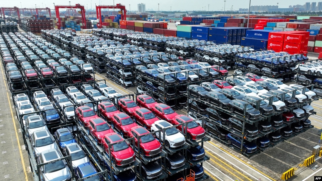 FILE - This Sept. 11, 2023, photo shows BYD electric cars waiting to be loaded on a ship stacked at the international container terminal of Taicang Port at Suzhou Port, in China's eastern Jiangsu Province. 