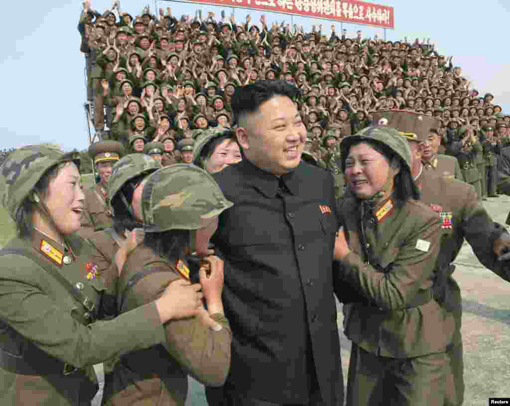 North Korean leader Kim Jong Un guides the multiple-rocket launching drill of women's sub-units under KPA Unit 851 in this undated photo released April 24, 2014 by North Korea's Korean Central News Agency (KCNA).