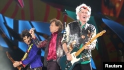 Keith Richards (R), Mick Jagger (C) and Ronnie Wood of the Rolling Stones perform a free outdoor concert at Ciudad Deportiva de la Habana sports complex in Havana, Cuba, March 25, 2016. The legendary rockers say they have never given permission to Donald Trump's presidential campaign to use their songs.