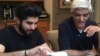 Danish Bashir eats dinner with his father, Imran, at their home in Springfield, Virginia. (C. Presutti/VOA)