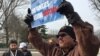 About 50 immigrants protested outside the Supreme Court, urging the justices to take up a case involving President Obama's executive order on immigration. (Carolyn Presutti/VOA)