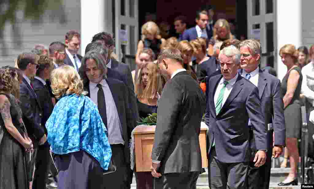 Courtney Kennedy Hill (in blue) and Paul Michael Hill, carrying the casket along with other Kennedy family members, are seen after the funeral mass for their daughter Saoirse Kennedy Hillin Centerville, Massachusetts, Aug. 5, 2019. Saoirse was a 22-year-old granddaughter of the late Robert F. Kennedy.