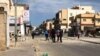 Locals examine a street recently hit by a bomb in Tripoli, Libya, March 27, 2020. (Courtesy of resident Mohammed Kikly)