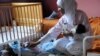 A healthcare worker tends to orphans in Marrakech, Morocco. The country is making substantial progress in improving childhood and maternal health, a UN Millennium Development Goal. (World Bank)