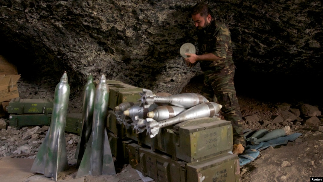 A Free Syrian Army fighter prepares ammunition inside a cave in Maaret al-Naaman village, in Idlib, Syria, Oct. 17, 2013.