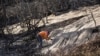 Rain in southern California creates mudflows but helps firefighters