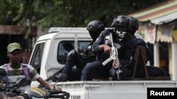 Police patrol the area due to gang activity that has forced residents to flee their homes, in Port-au-Prince, Haiti, Oct. 20, 2024.