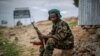 FILE - A fighter loyal to the Tigray People's Liberation Front mans a guard post on the outskirts of the town of Hawzen, then-controlled by the group but later re-taken by government forces, in the Tigray region of northern Ethiopia, May 7, 2021.