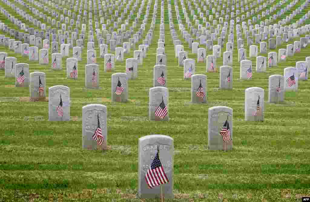 The graves of war veterans are seen during the annual 'Flag Placement Ceremony' to honor the fallen for Memorial Day at the Los Angeles National Cemetery, California, May 25, 2019.