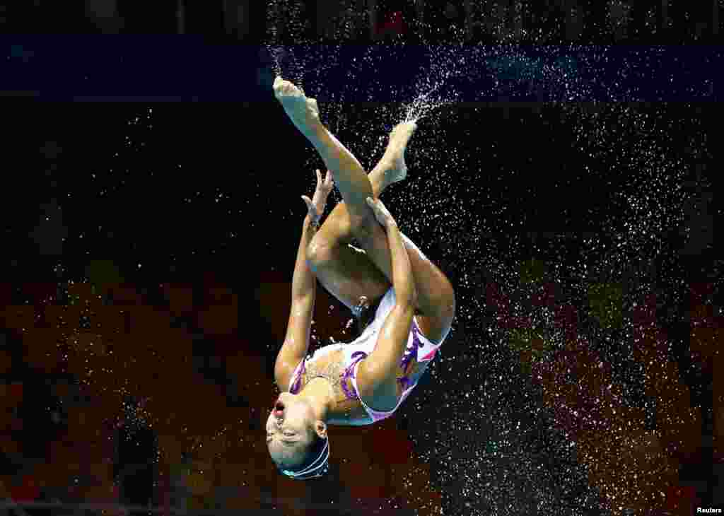 Team Japan competes during the women's free combination preliminary swimming event in the 18th FINA World Swimming Championships at Yeomju Gymnasium, Gwangju, South Korea.
