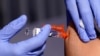 FILE - A patient is given a flu vaccine in Lynwood, Calif., Oct. 28, 2022. The Centers for Disease Control and Prevention estimates 19,000 people have died from the flu so far this winter, including 86 children. 
