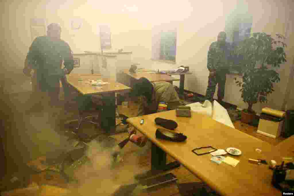 Pro-Russia protesters storm the governor's business premises in Donetsk, Ukraine, May 3, 2014.