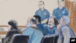 FILE - In this Oct. 6, 2012 courtroom drawing, seated from left, defense attorney Sabrina Shroff, defendants Kahlid al-Fawwaz and Adel Abdul Bary and attorney Andrew Patel appear before a judge in Manhattan federal court in New York.