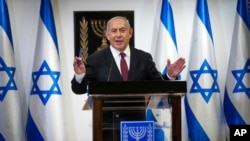 Israeli Prime Minister Benjamin Netanyahu delivers a statement at the Israeli Knesset, or parliament, in Jerusalem, Dec. 22, 2020.