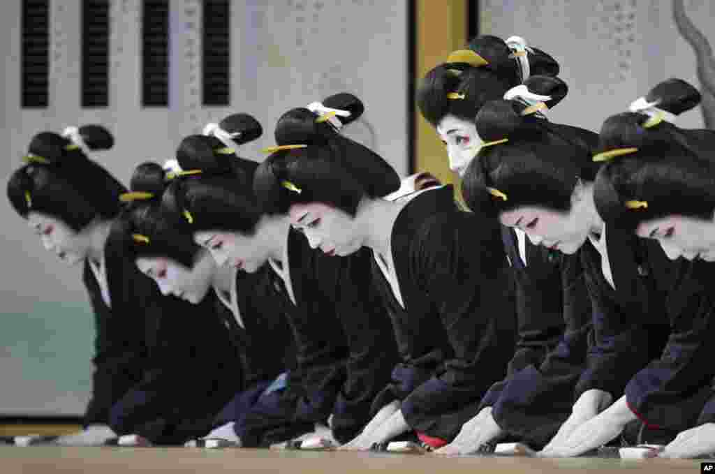 Japanese traditional female entertainers, or geisha, from Shimbashi area rehearse for "Azumaodori" at Shimbashi Enbujo Theater in Tokyo.