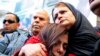 Tunis Crowd Shows Support for Missing Journalists