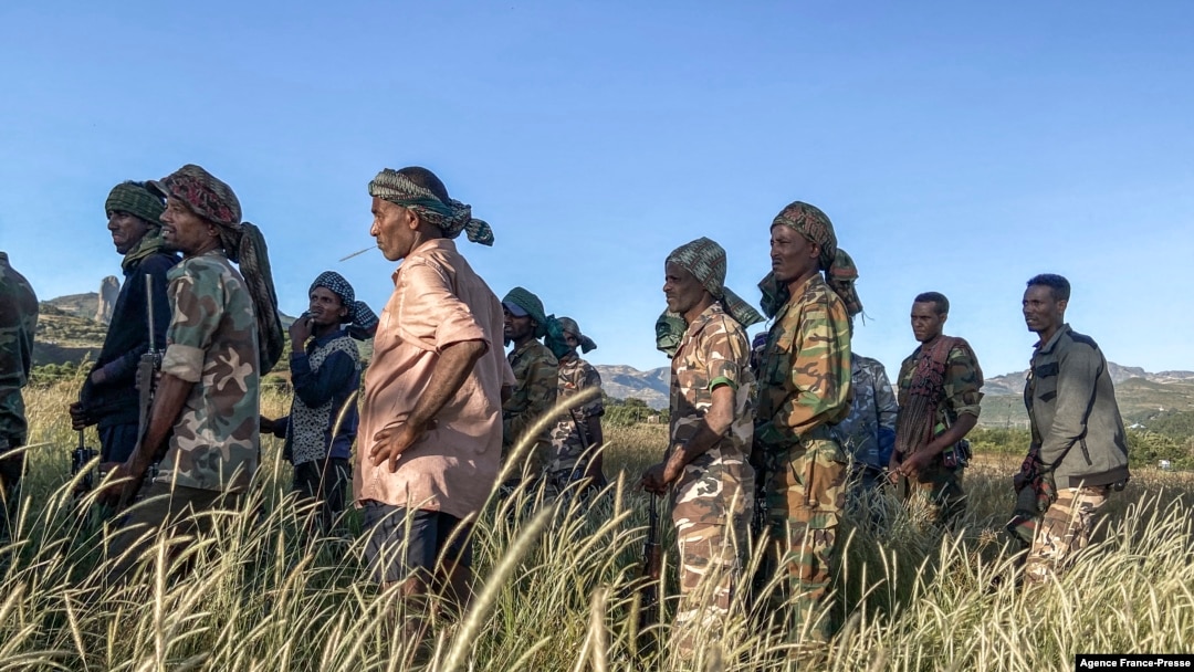 FILE - Amhara militia men who fight alongside federal and regional forces against northern region of Tigray, receive training in the outskirts of the village of Addis Zemen, north of Bahir Dar, Ethiopia, on Nov. 10, 2020. 