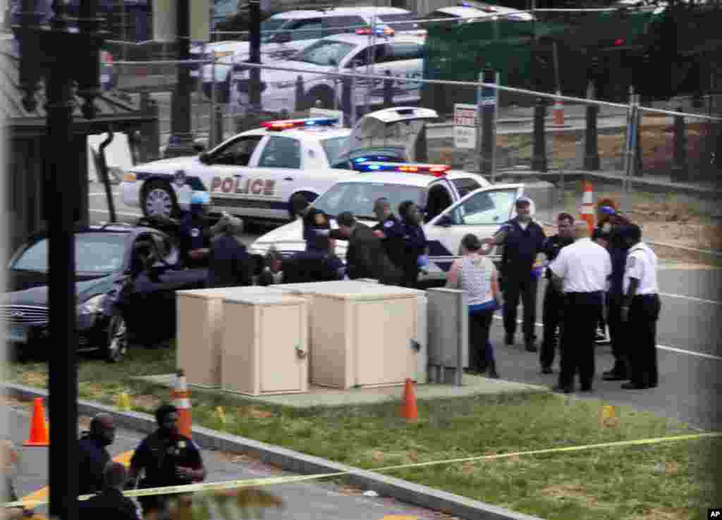 Emergency personal help an injured person after a shooting on Capitol Hill.