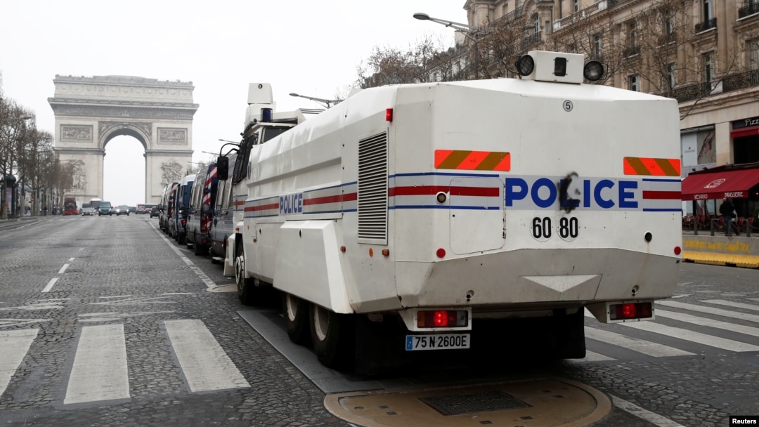 A French police water cannon vehicle is in place on the Champs-Elysees during the the 19th consecutive national protest Saturday of the "yellow vest" movement in Paris, March 23, 2019.