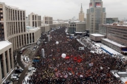 FILE - Demonstrators gather to protest recent parliamentary election results in Moscow, Dec. 24, 2011.