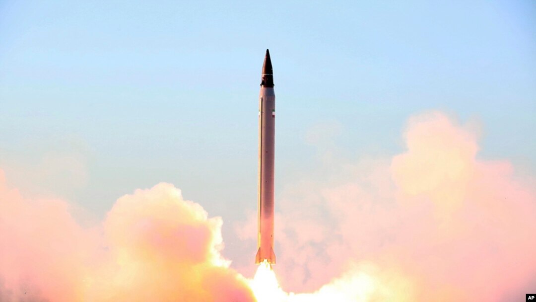 FILE - Image released by official website of the Iranian Defense Ministry claims to show the launching of an Emad long-range ballistic surface-to-surface missile in an undisclosed location.
