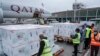 FILE - Officials receive boxes of Moderna coronavirus vaccine at the airport in Nairobi, Kenya, Sept. 6, 2021. 