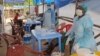 Medical personnel inside a clinic take care of Ebola patients in the Kenema District on the outskirts of Kenema, Sierra Leone, July 27, 2014