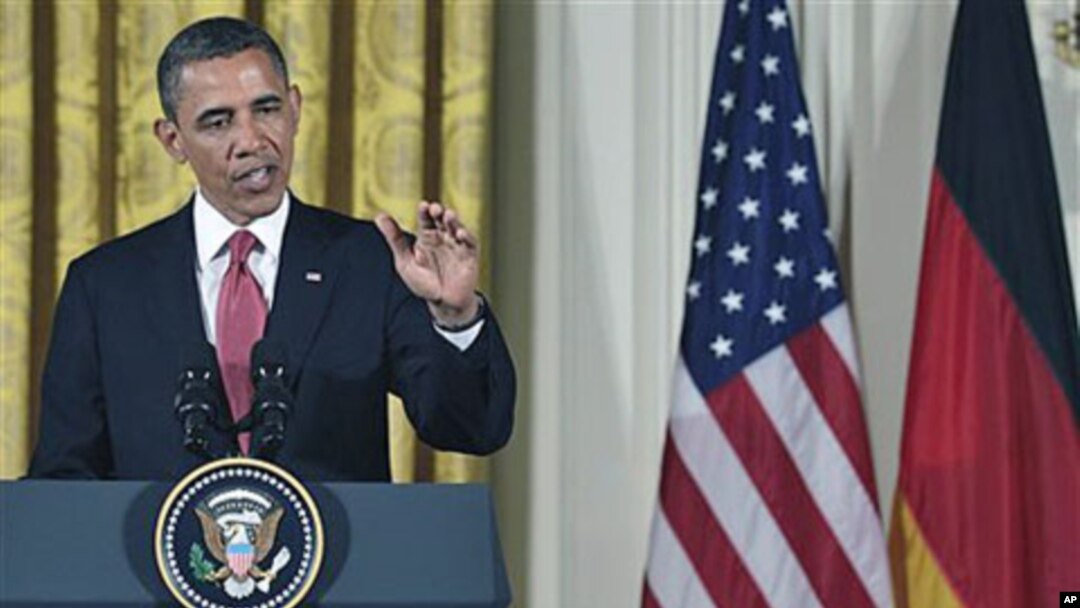 President Barack Obama answers a question during a joint news conference with German Chancellor Angela Merkel in the East Room of the White House in Washington, DC, June 7, 2011