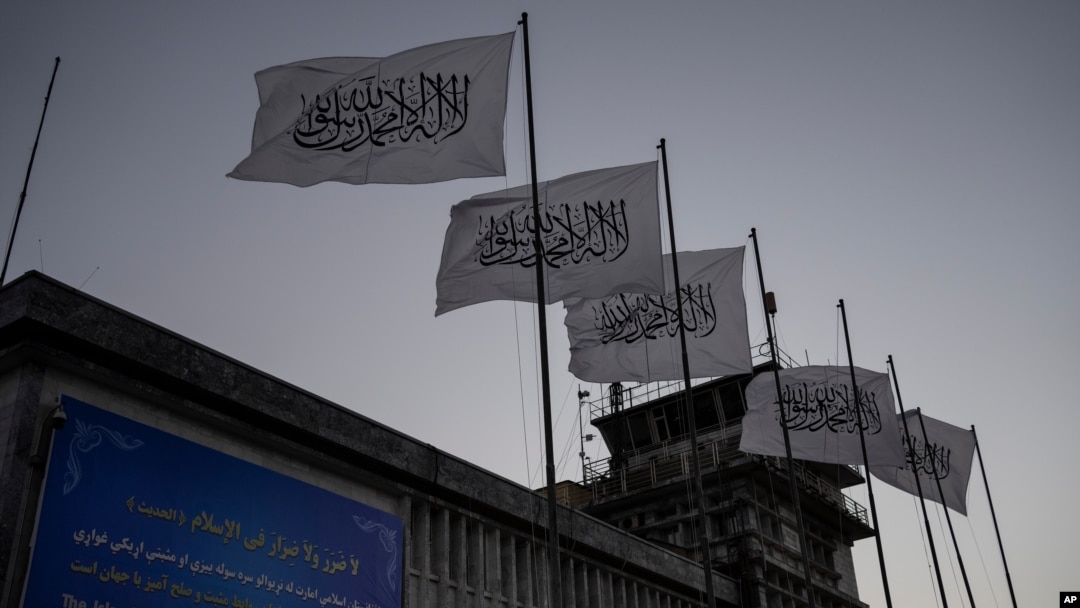 Taliban flags flutter at the airport in Kabul, Afghanistan, Sept. 9, 2021. 
