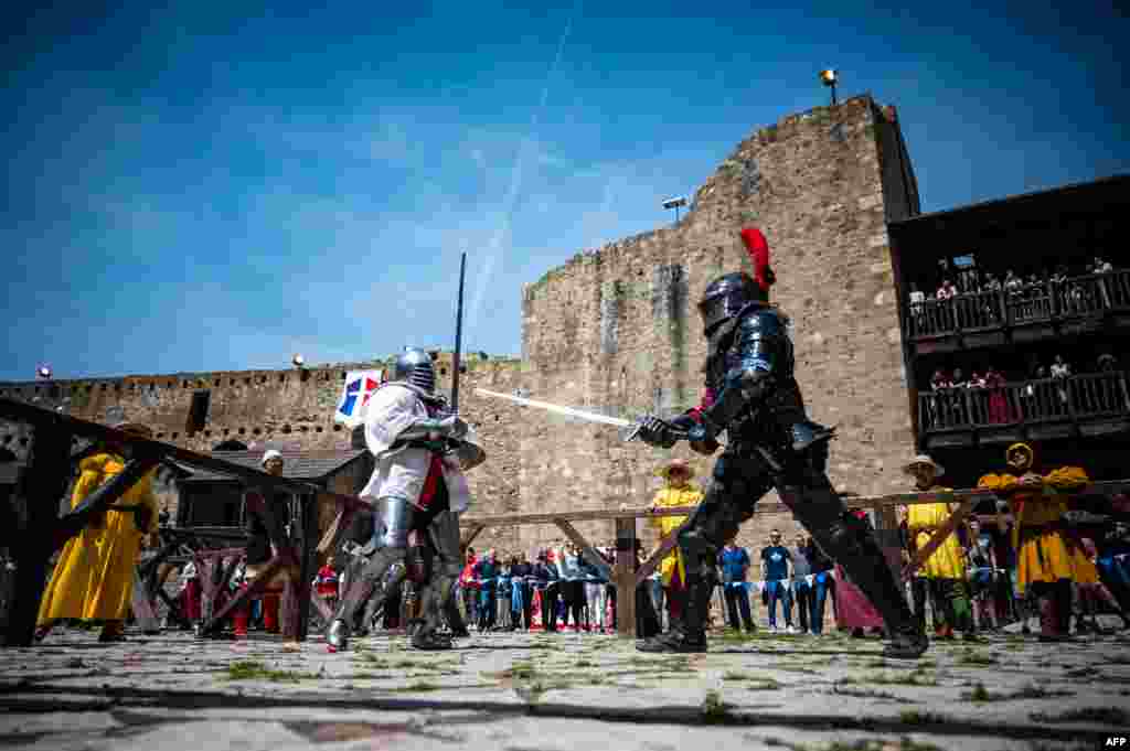 Participants wearing armours fight during the medieval tournament "Battle of the Nations" at the Smederevo fortress, in eastern Serbia, May 4, 2019.